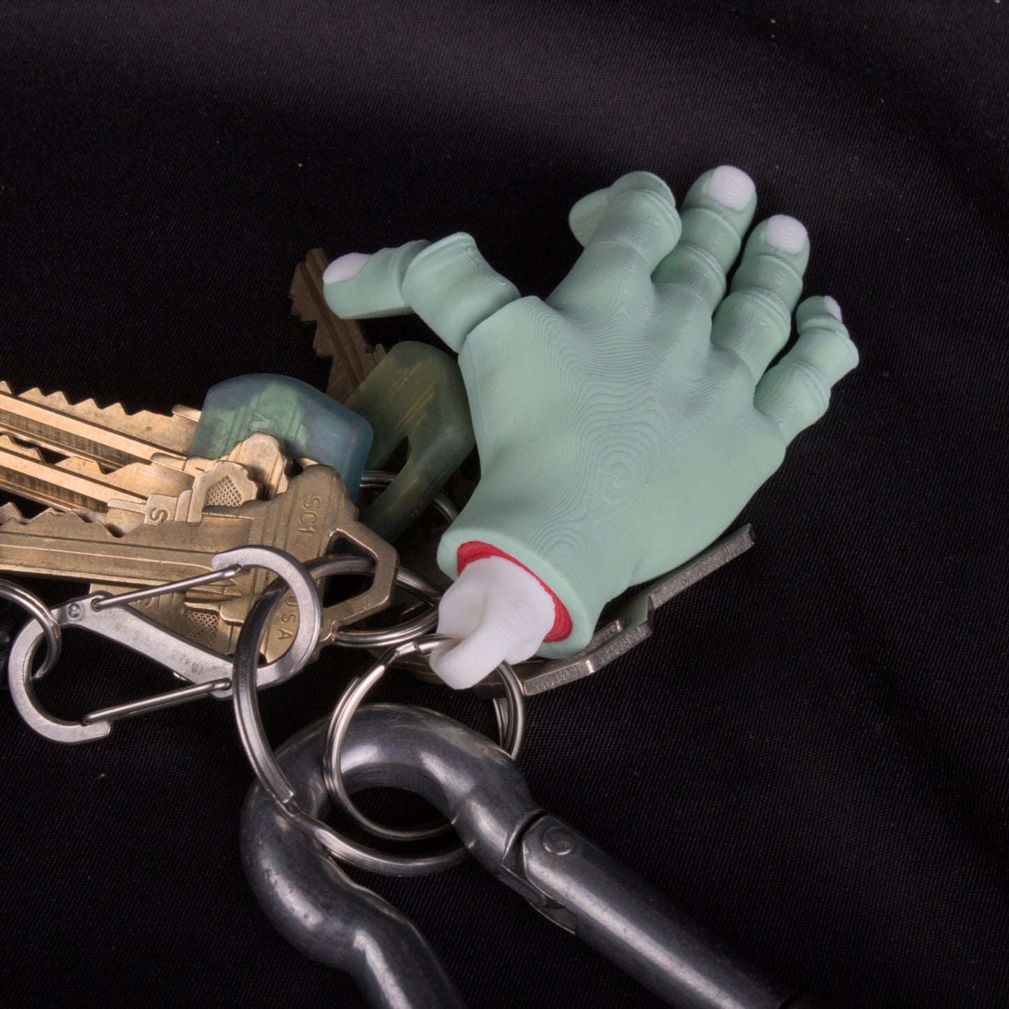 Severed hand keychains